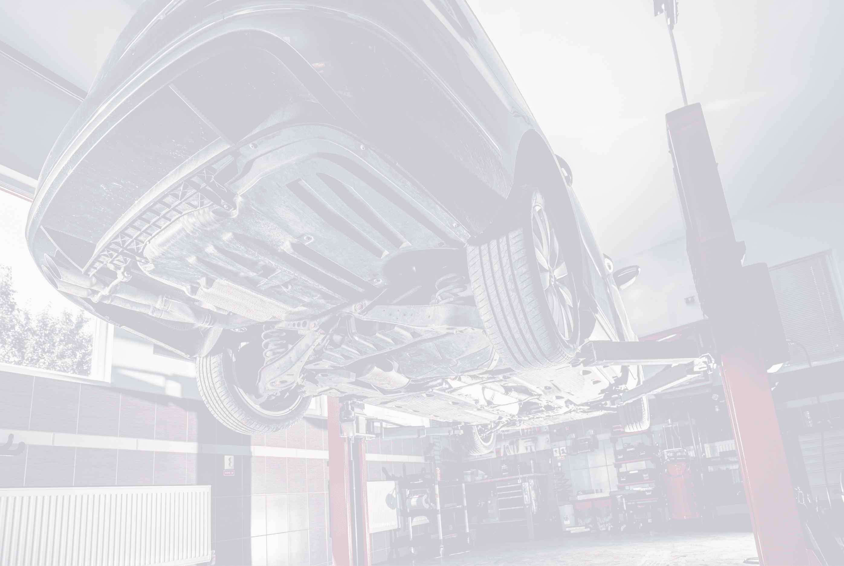 Lifted car in garage. Repair concept in workshop